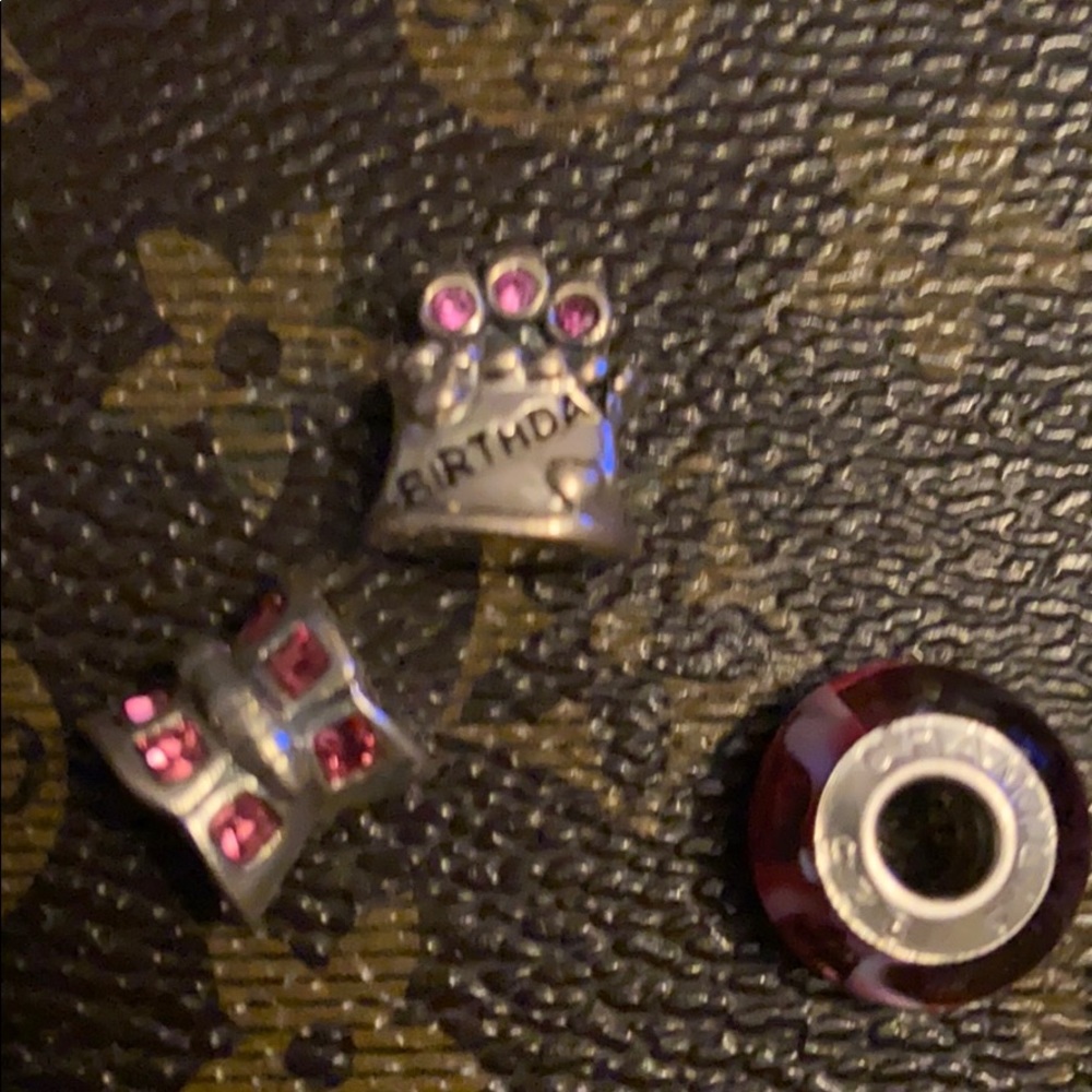 Three chamilia charms
